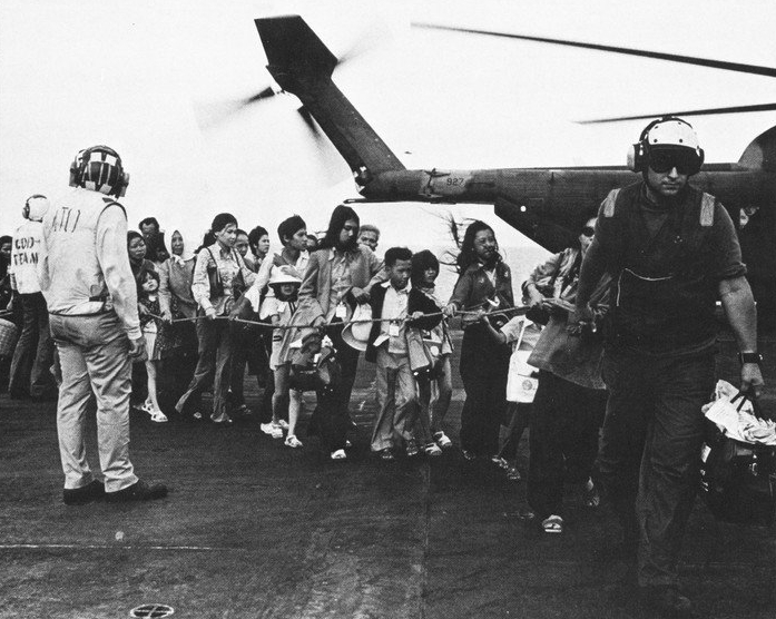 The lucky ones who made it from the embassy to the USS Midway. Photo via Wikimeida and the U.S. Navy.